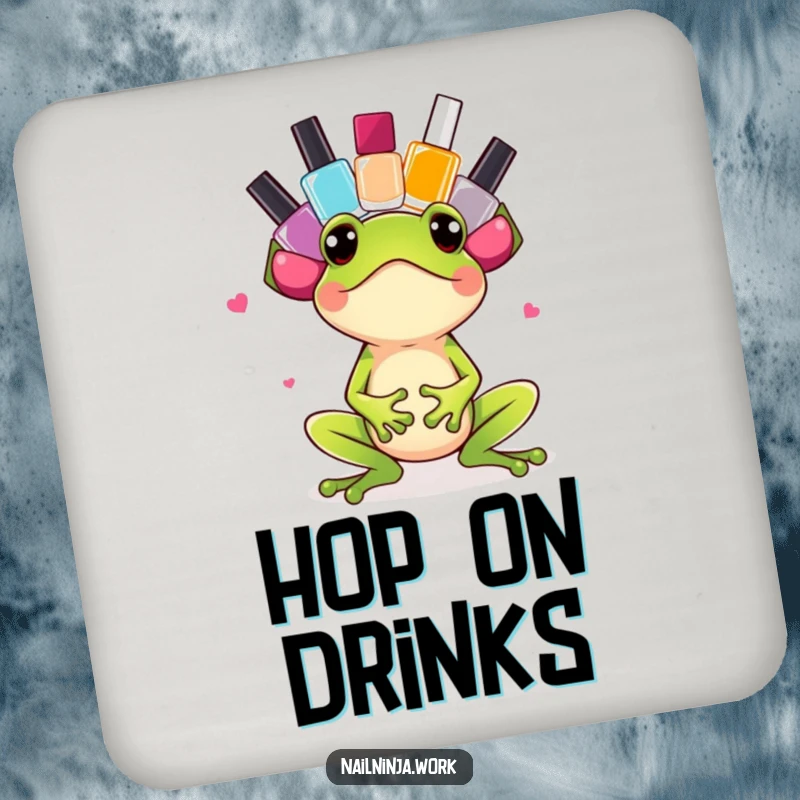 Funny excited green frog balancing colorful nail polish bottles on its head, on a drink coaster.